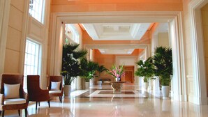 A spacious lobby with a polished floor, large windows, and potted plants. - RSL Cold & Hot Springs Resort Suao (Suao)