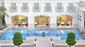 A hotel with a pool, outdoor seating, and a well-maintained garden. - RSL Cold & Hot Springs Resort Suao (Suao)