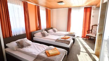 Family Room | Premium bedding, minibar, in-room safe, blackout drapes