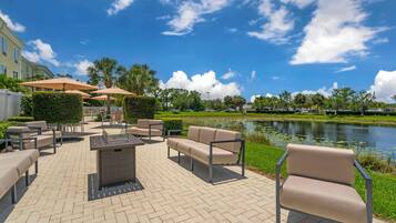 Relax by the fire and enjoy the serene views of the surrounding water and lush greenery.