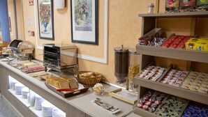A buffet setup with various food items and condiments. - Hotel Las Moradas (Ávila)