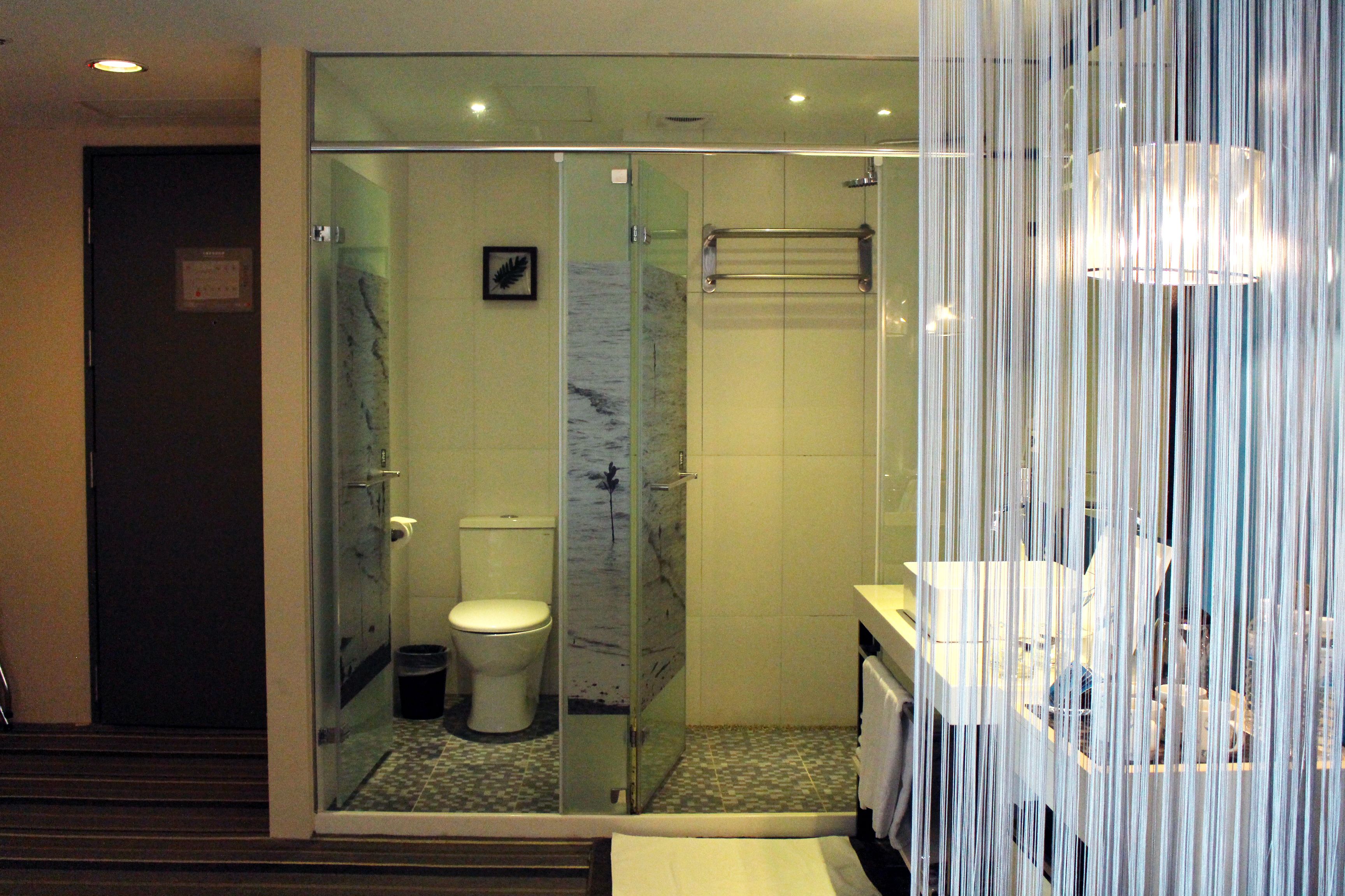 shower, hair dryer, slippers, towels