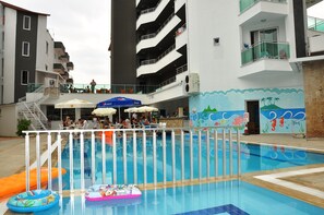 Indoor pool, outdoor pool, pool umbrellas, pool loungers