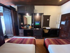 Deluxe Twin Room Pool View | Minibar, in-room safe, individually decorated, desk