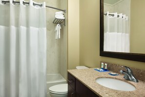 Combined shower/tub, designer toiletries, hair dryer, towels