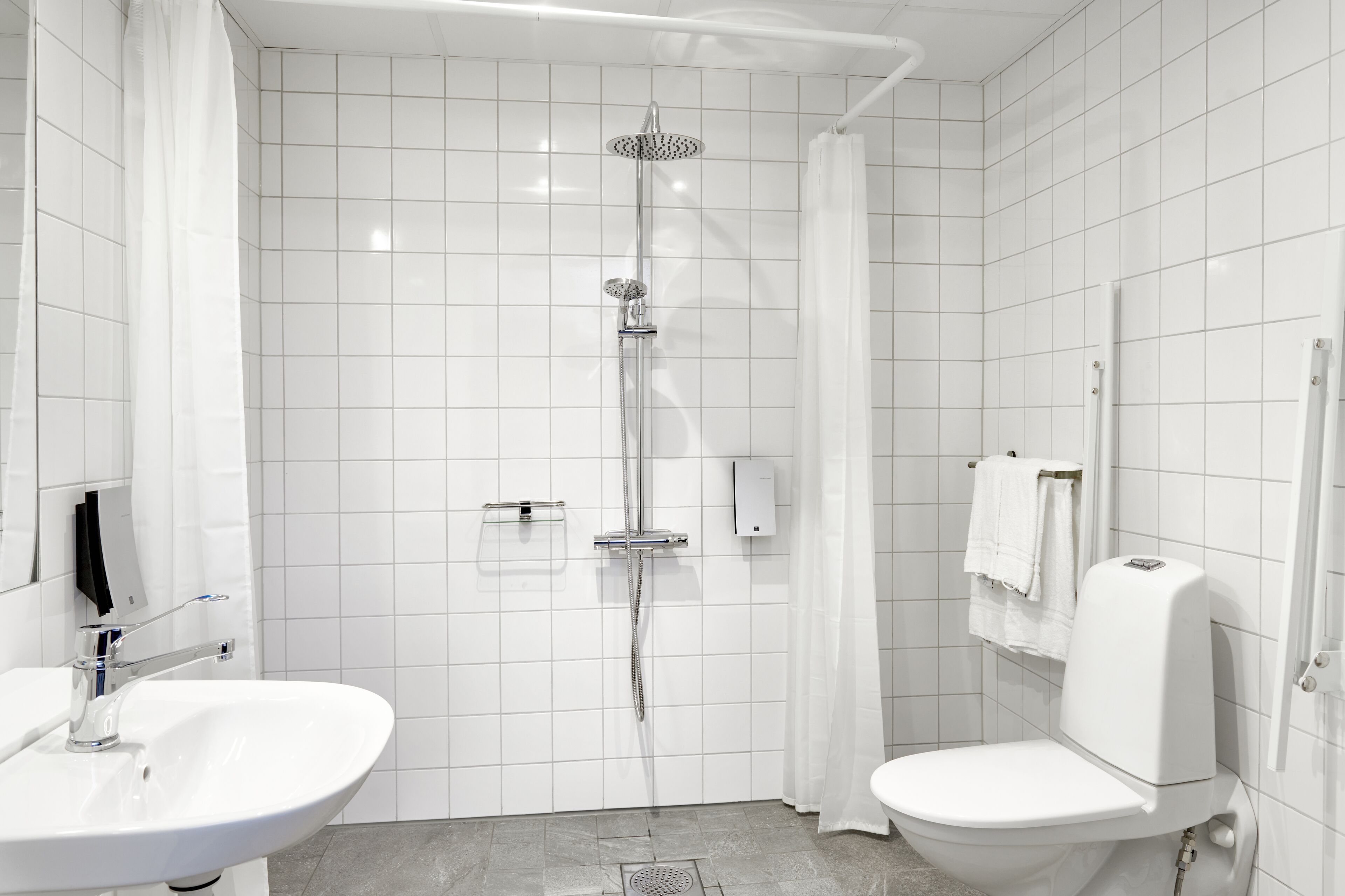 superior room | bathroom | shower, hair dryer, towels
