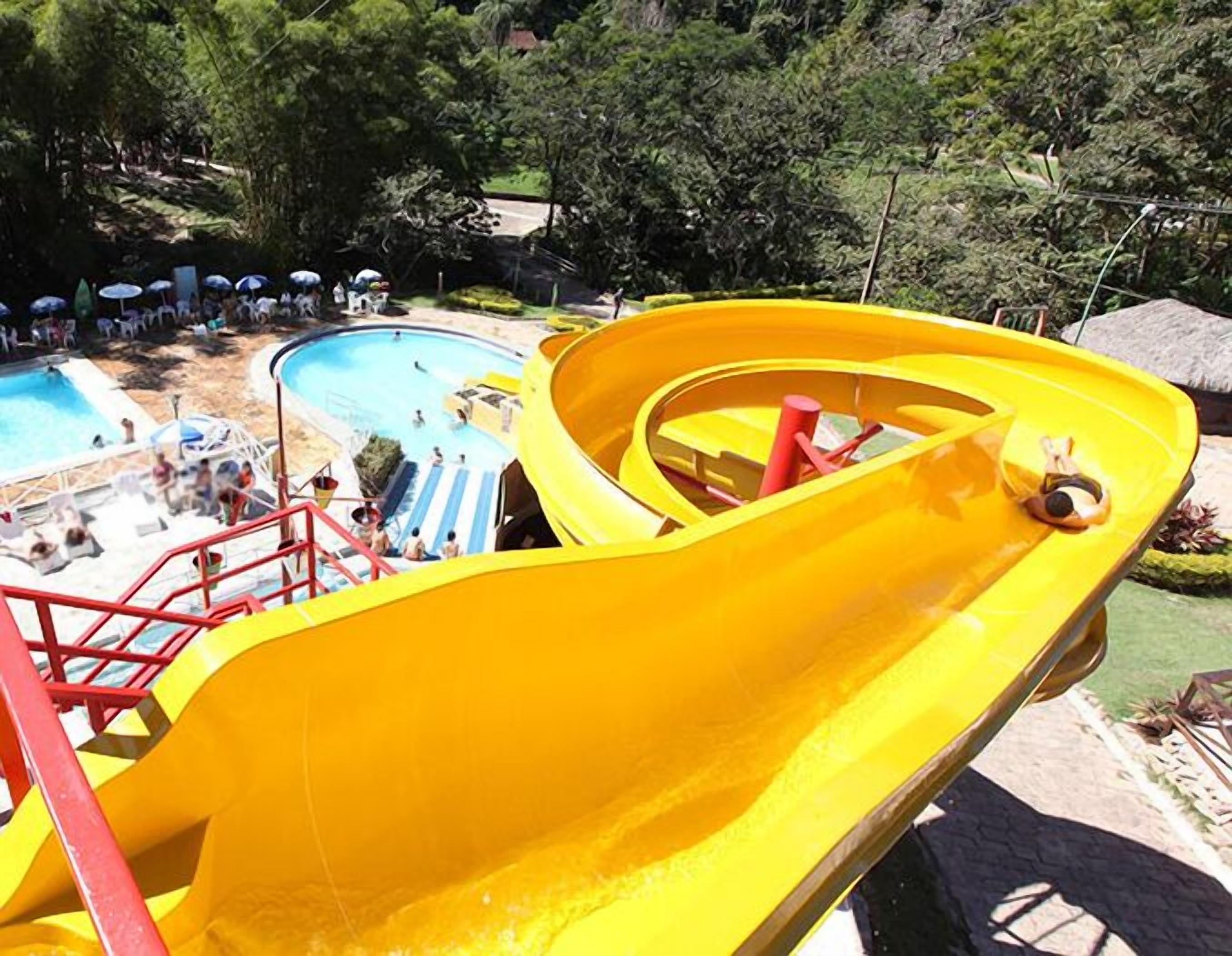 A water slide with a pool area in the background.