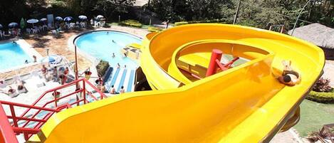 A water slide with a pool area in the background.