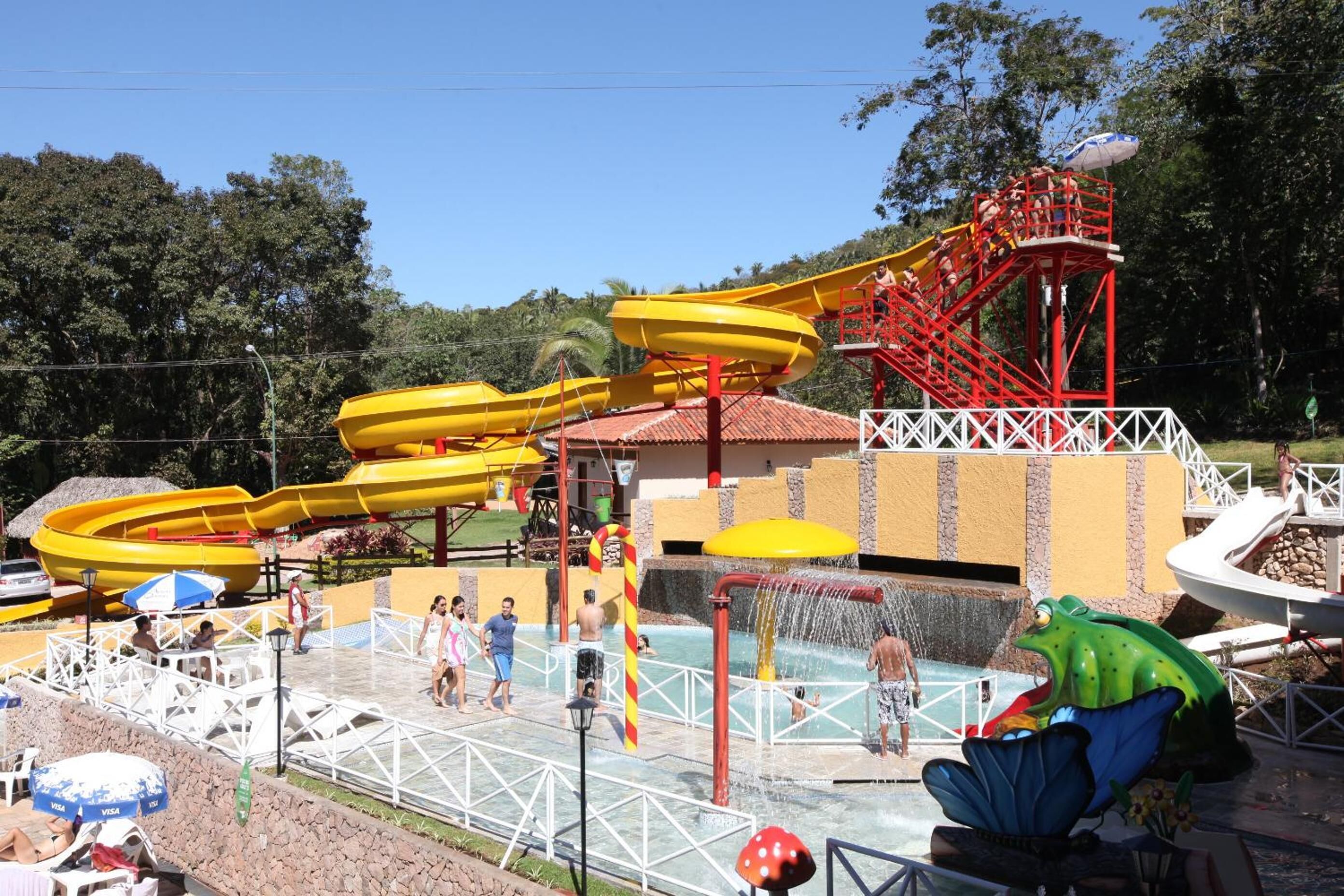 A water park with multiple slides and a pool area.