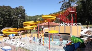 A water park with multiple slides and a pool area.