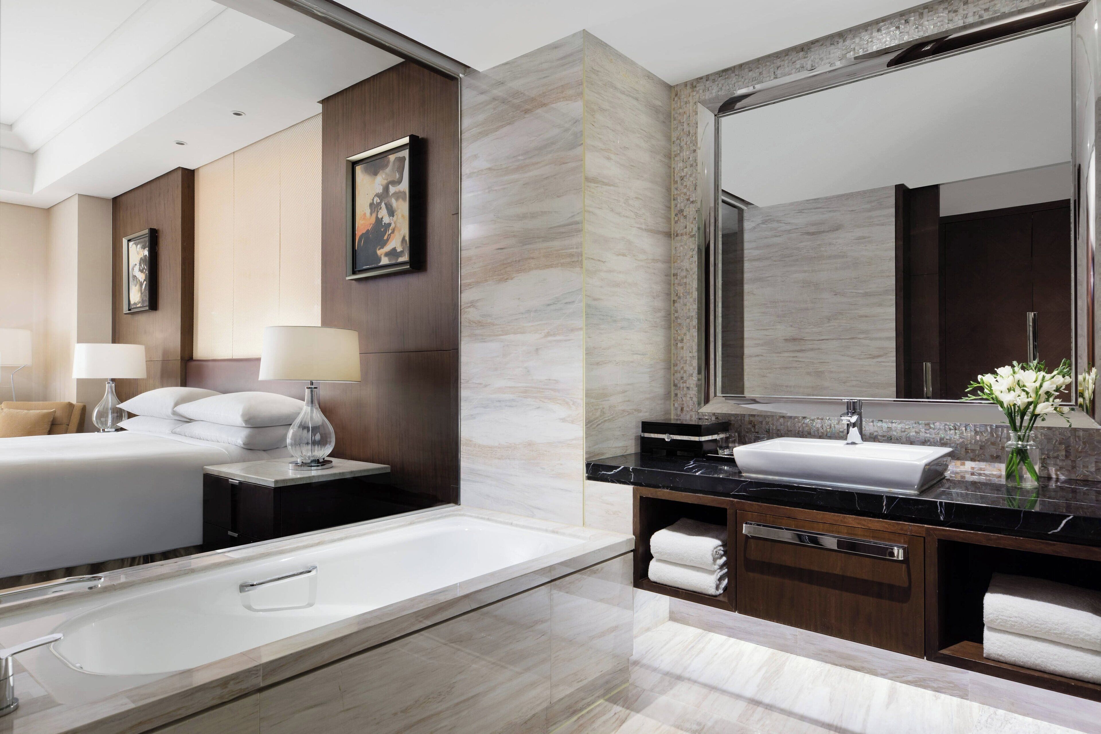 executive suite, 1 king bed | bathroom | separate bathtub and shower, rainfall showerhead, free toiletries