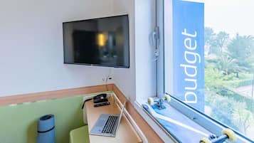 Desk, blackout drapes, soundproofing, free WiFi