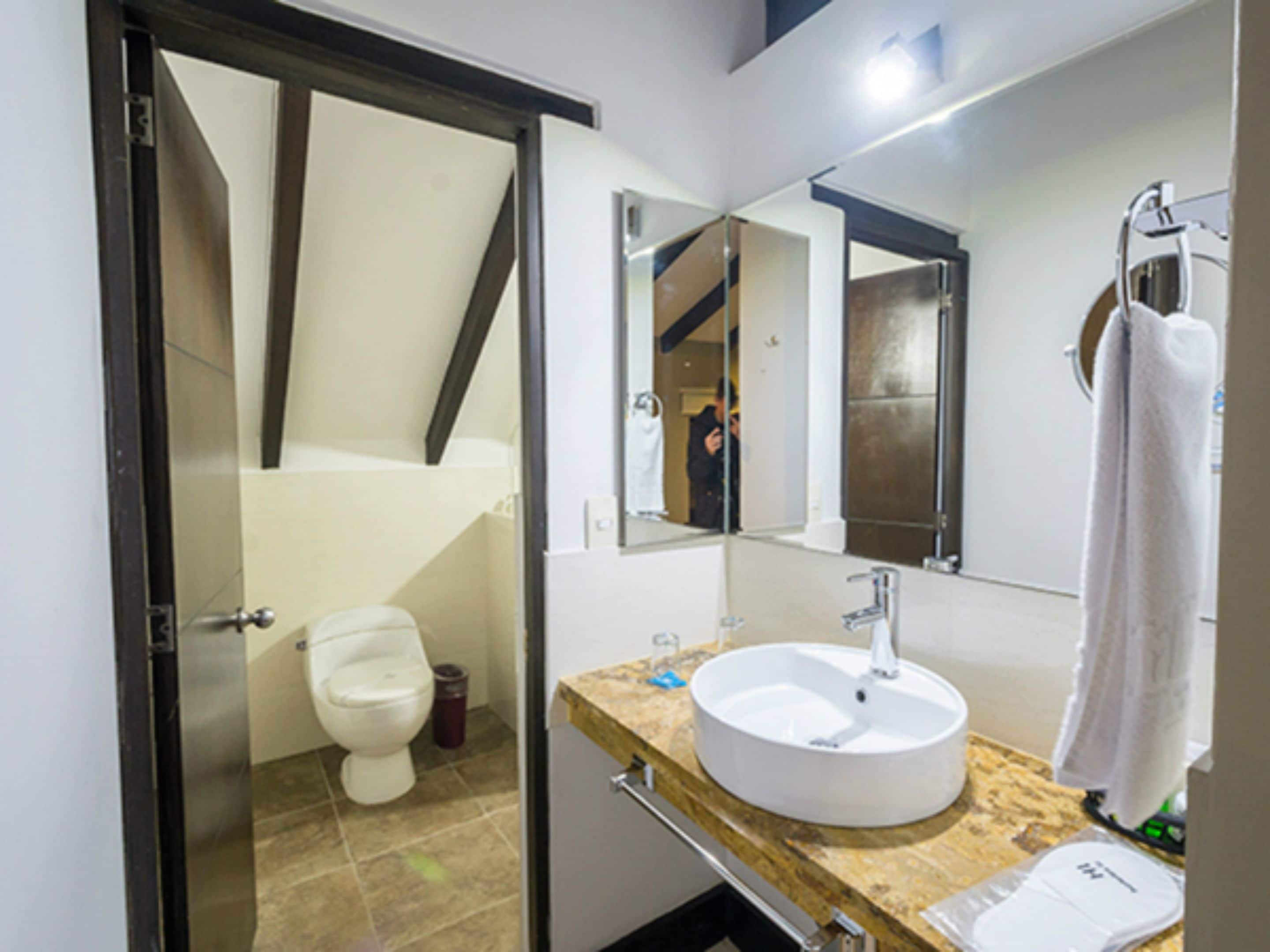 shower, designer toiletries, hair dryer, slippers