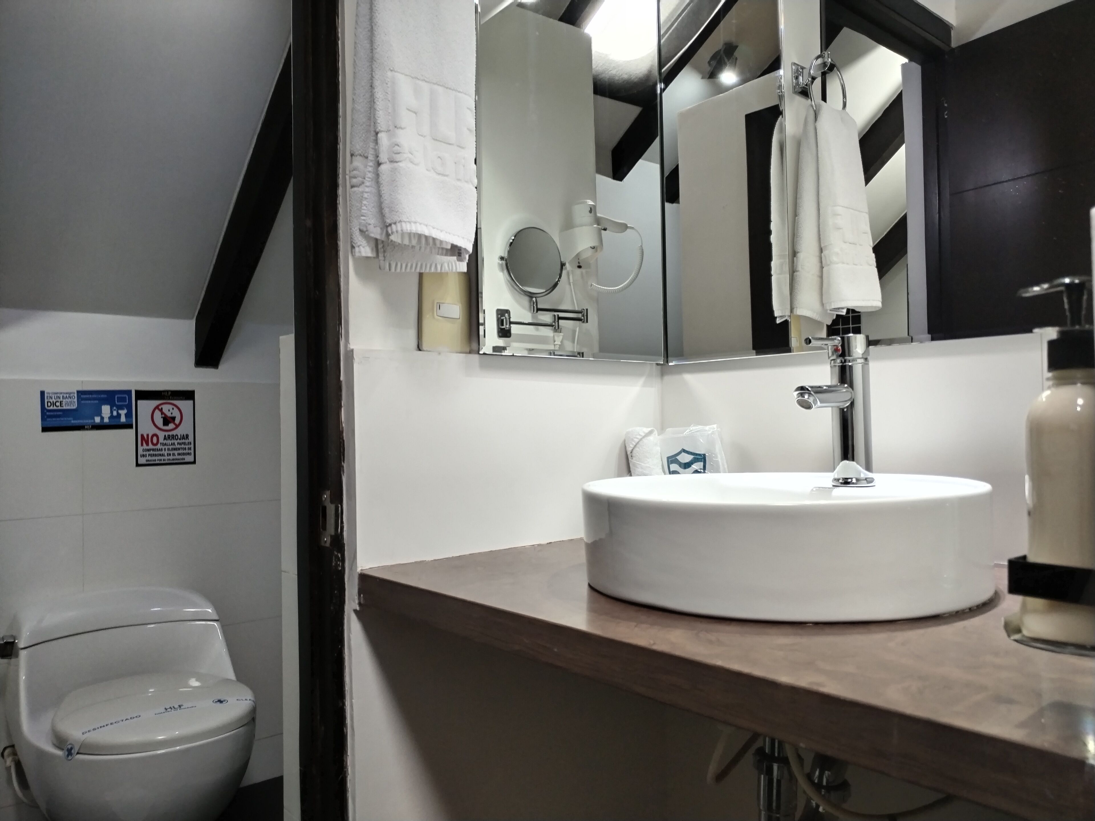 shower, designer toiletries, hair dryer, slippers