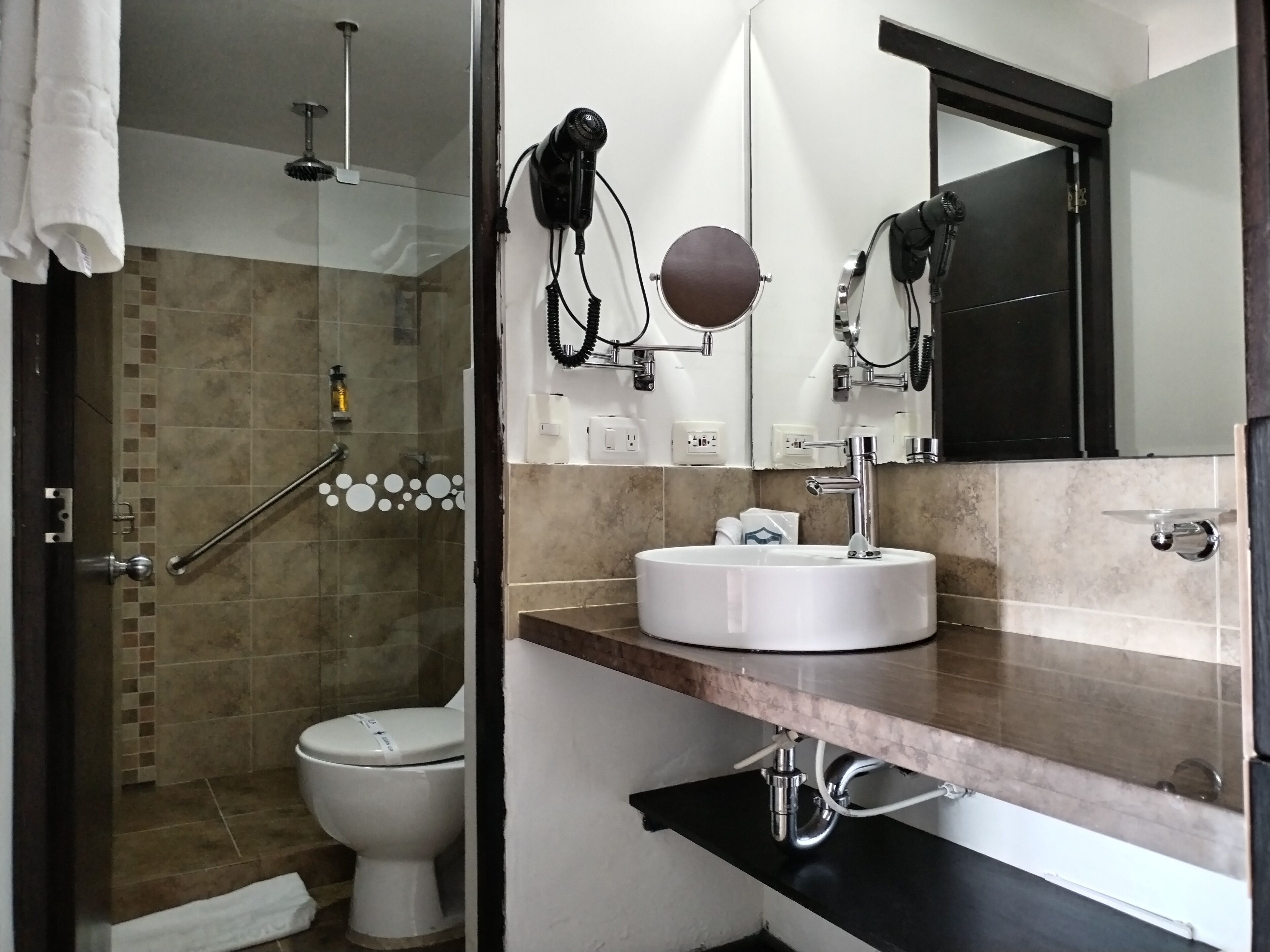 standard suite | bathroom | shower, designer toiletries, hair dryer, slippers
