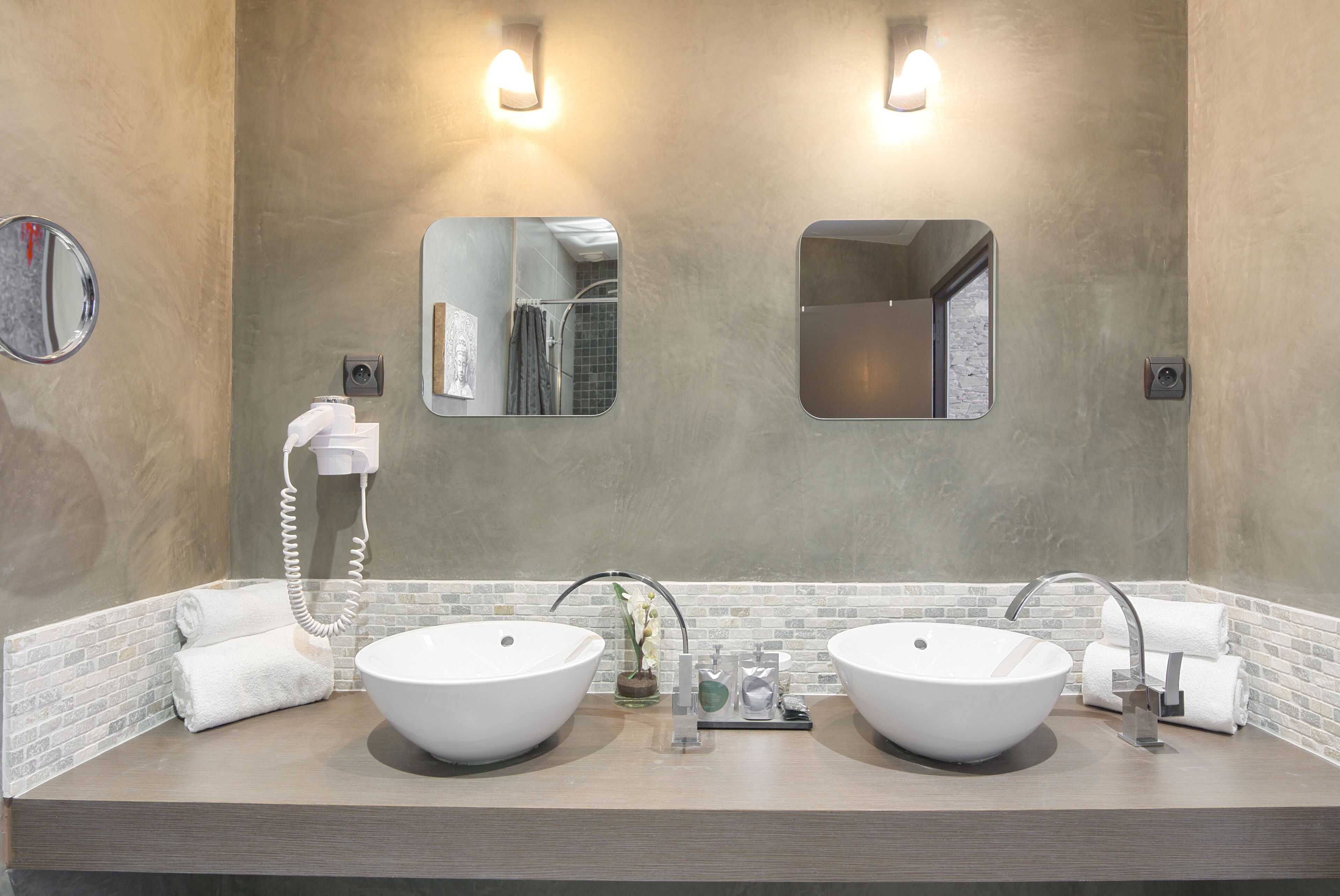 designer toiletries, hair dryer, towels