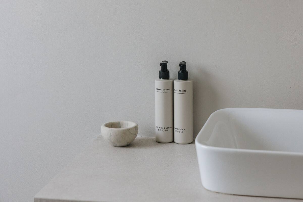 designer toiletries, hair dryer, bathrobes, heated floors