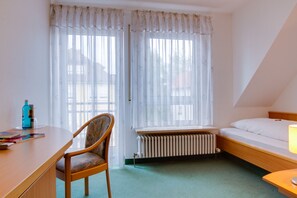 Premium bedding, laptop workspace, blackout curtains, iron/ironing board