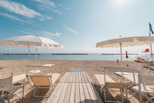 Private beach, sun loungers, beach umbrellas, windsurfing