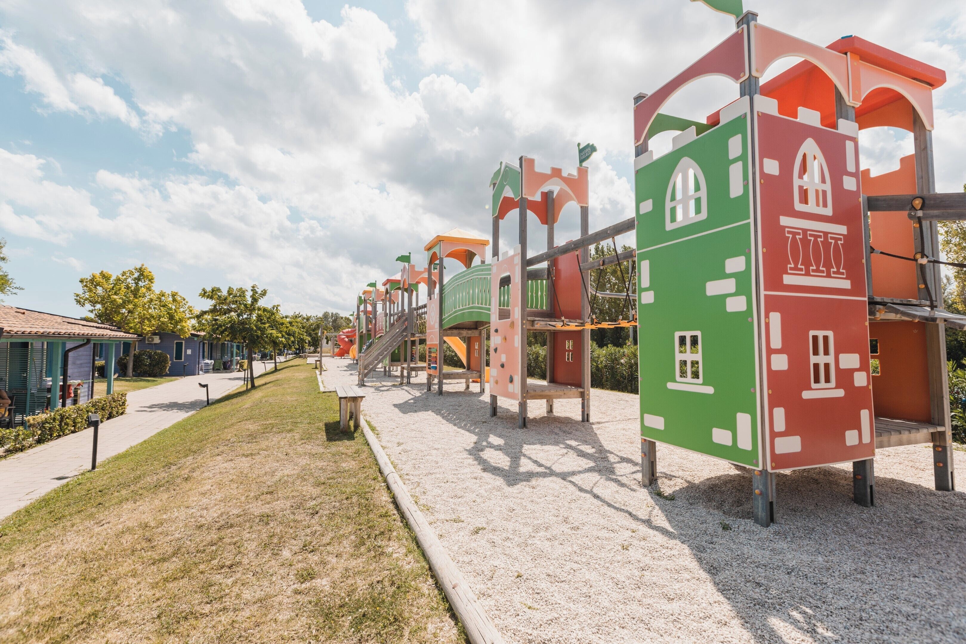 A playground with climbing structures and slides.