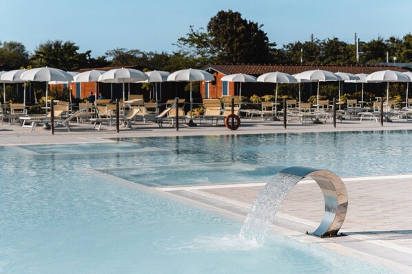 Seasonal outdoor pool, pool umbrellas, pool loungers