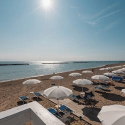 Private beach, sun loungers, beach umbrellas, windsurfing