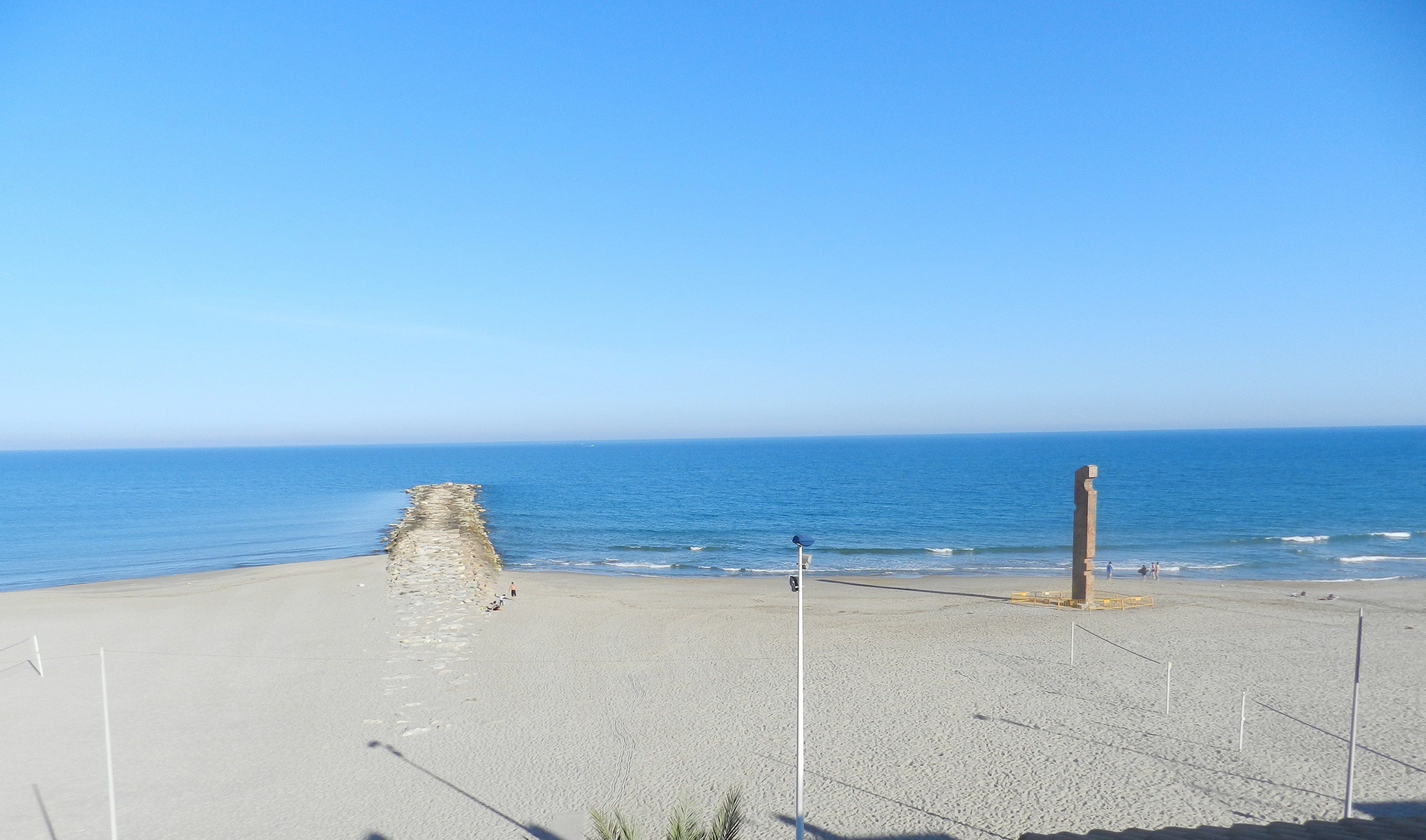 on the beach, sun-loungers, beach umbrellas, beach bar