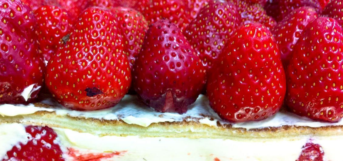 A dessert with strawberries on top.