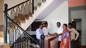 A staircase with ornate railings and a handrail. - Shanti's Hotel Sonai (Mahabaleshwar)