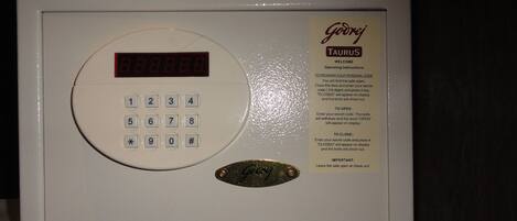 A digital keycard reader with instructions for programming a personal code.