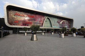 A modern building with a large advertisement for Media Markt and CinemaMaxim. - ibis Istanbul Esenyurt (Istanbul)