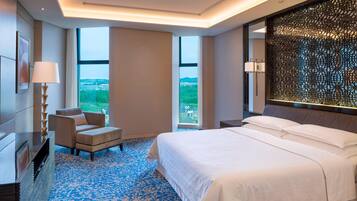 Premium bedding, down comforters, free minibar items, in-room safe