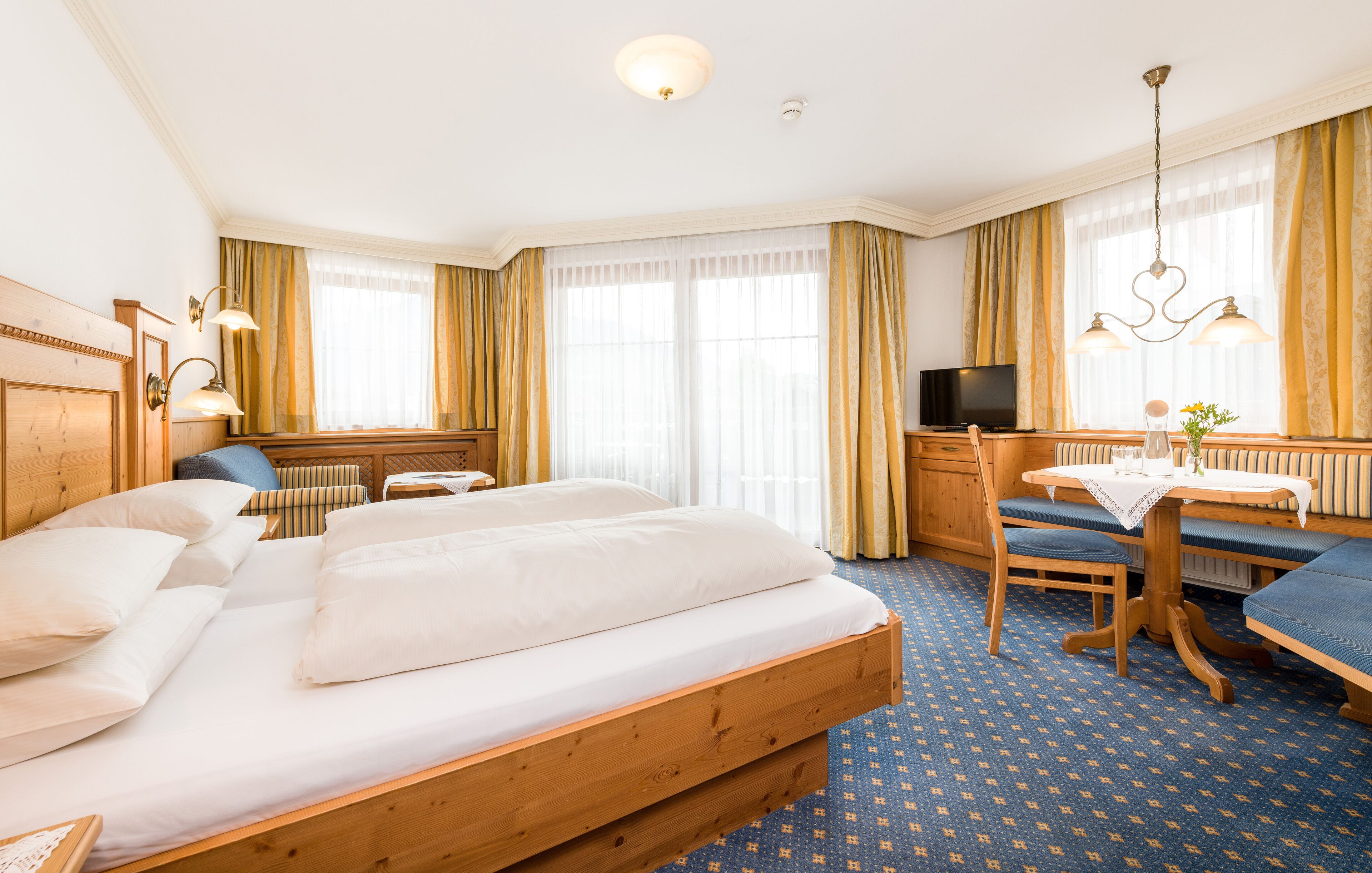 deluxe double room, balcony, mountain view | in-room safe, desk, cots/infant beds, free wifi