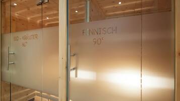 Experience the warm ambiance of this hotel's interior, featuring frosted glass doors with a natural aesthetic.