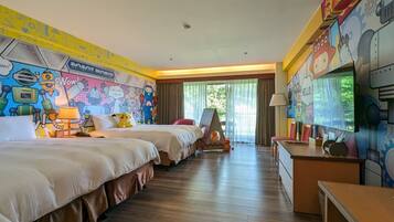 A hotel room with two beds, a desk, and a mural on the walls.