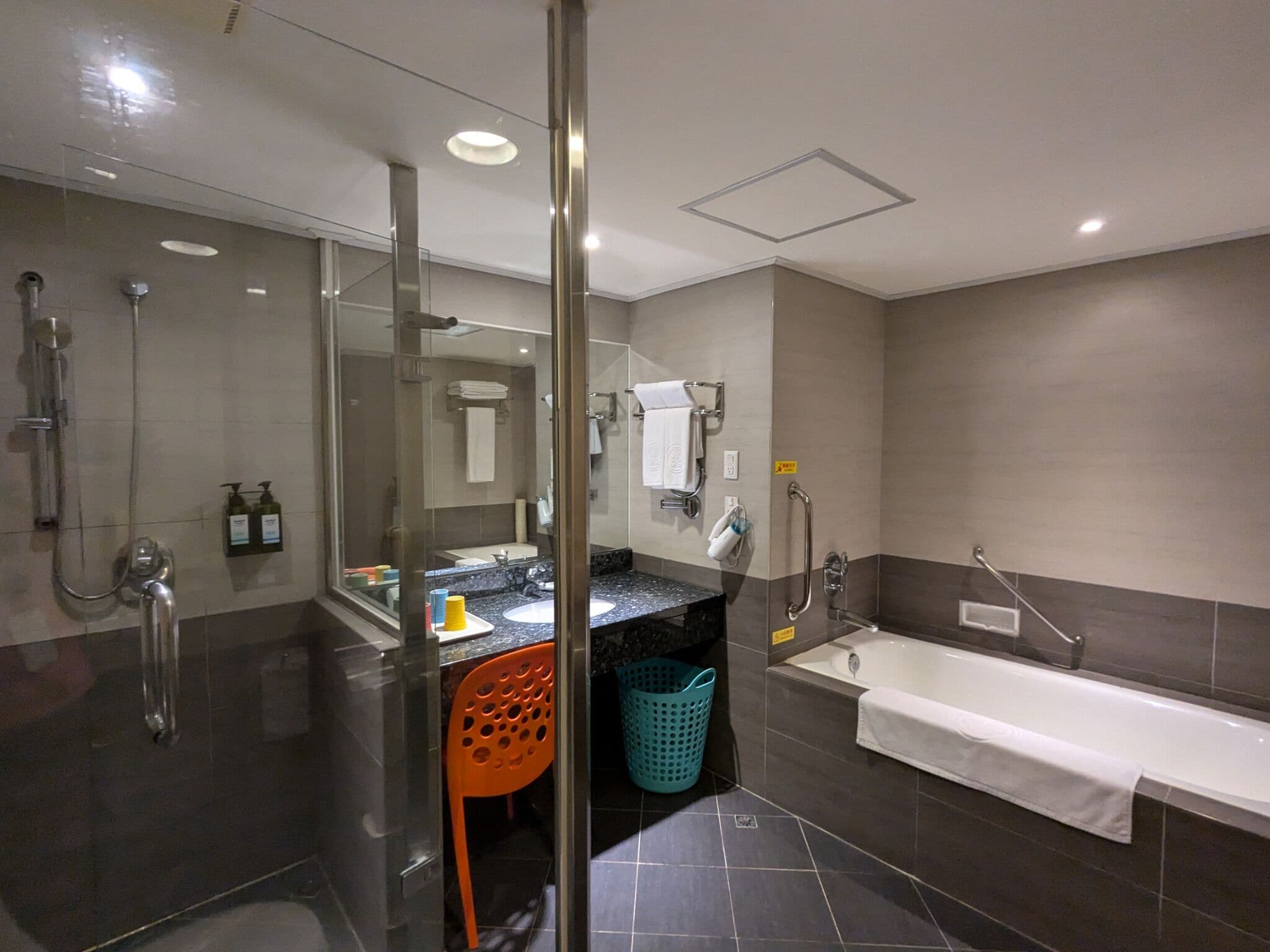 separate bathtub and shower, rainfall showerhead, hair dryer, towels