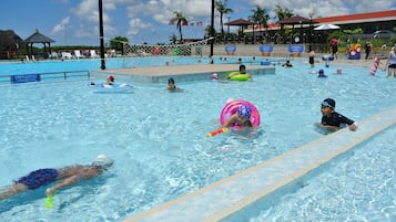 Outdoor pool, pool loungers, lifeguards on site