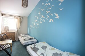 Twin Room, Shared Bathroom | Blackout drapes, iron/ironing board, free WiFi