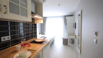 Fridge, microwave, stovetop, coffee/tea maker