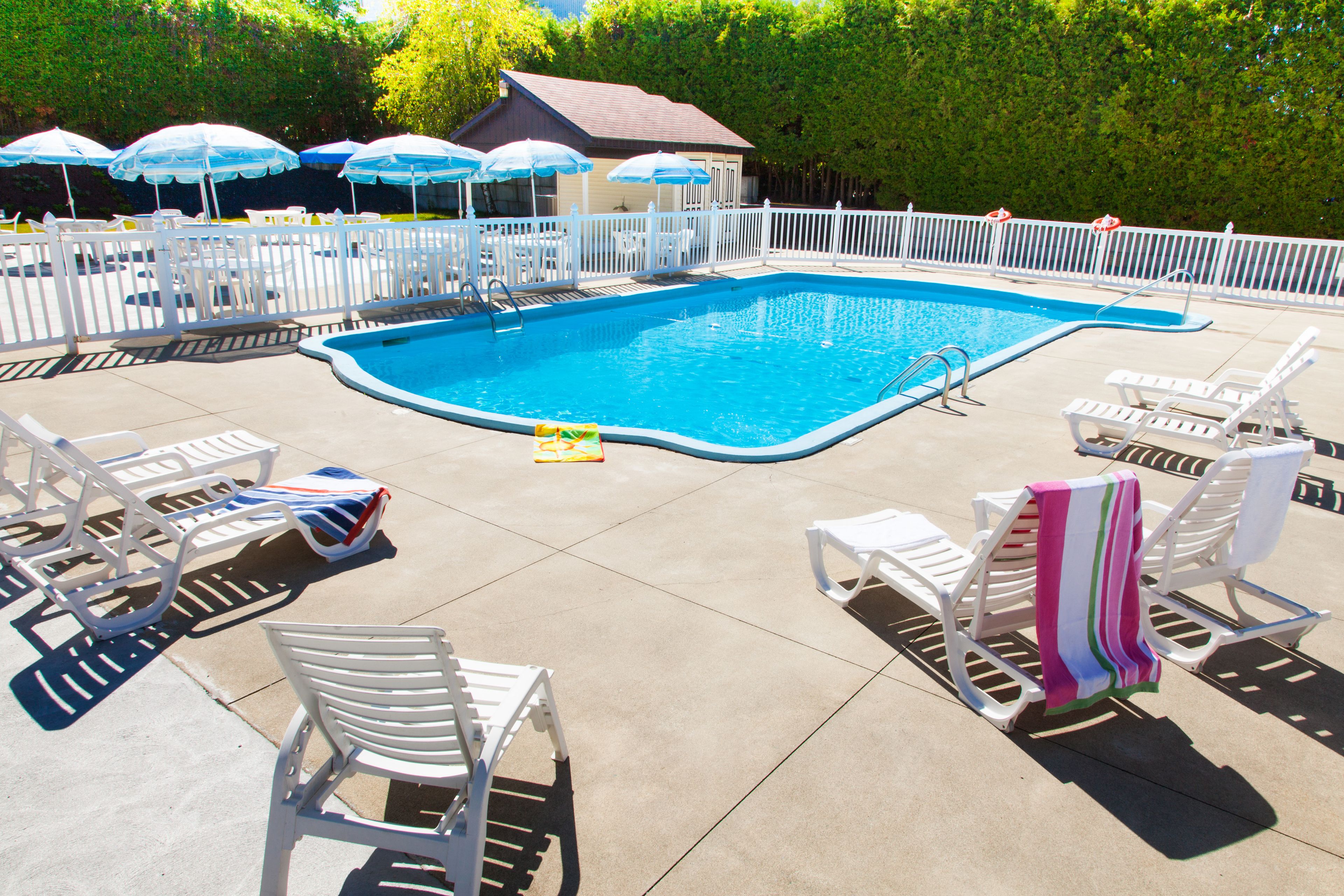 Outdoor pool, open 9 AM to 9 PM, pool umbrellas