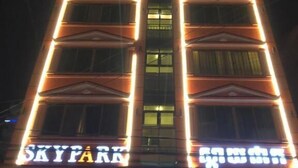 A building with illuminated signage reading "SKYFAR" and "GUEST HOUSE". - Sky Park Guesthouse (Phnom Penh)