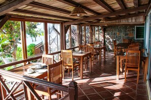Breakfast, lunch, dinner served; local cuisine, beach views  - Chantauvent Guesthouse (Blue Bay)