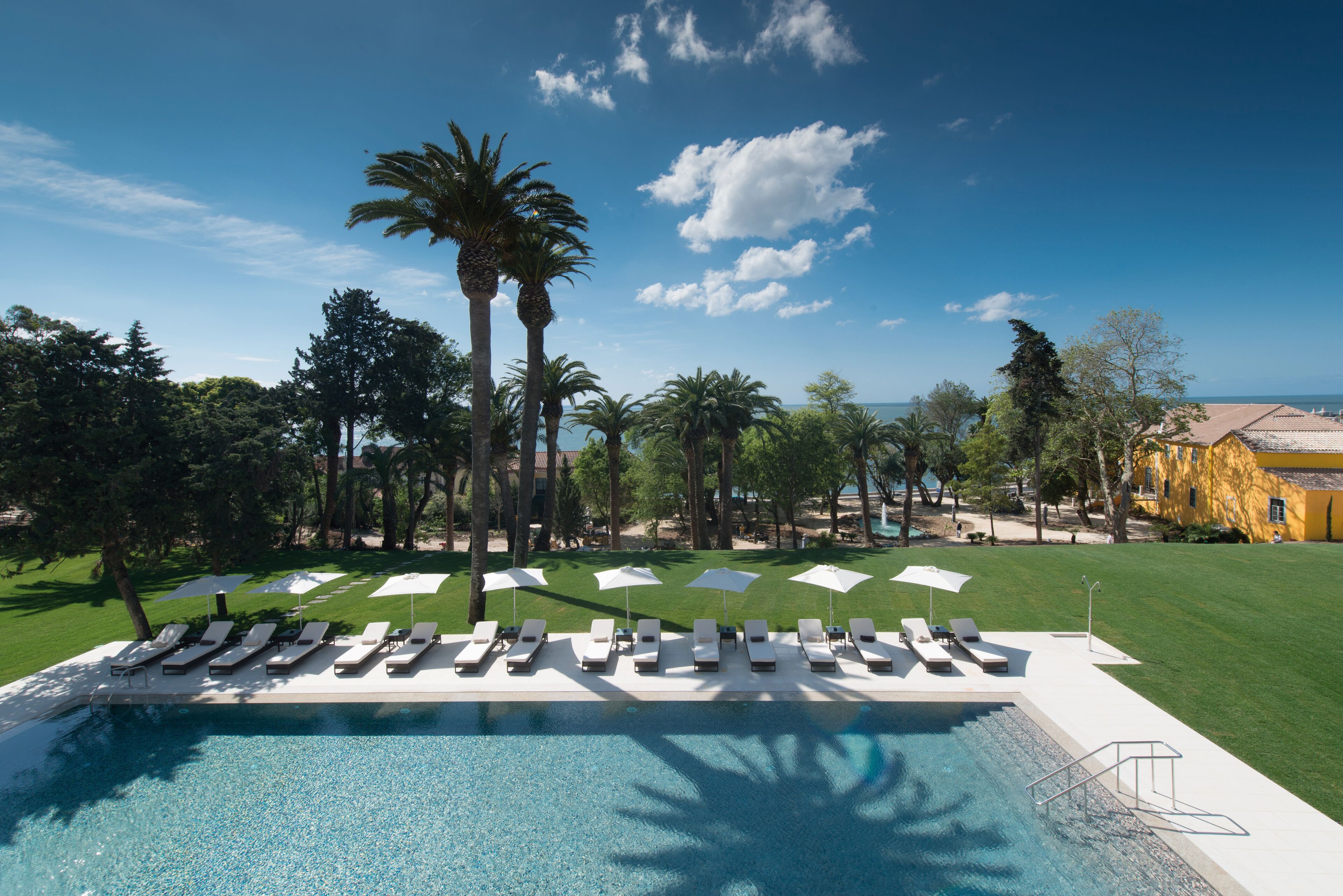 Indoor pool, outdoor pool, pool umbrellas, pool loungers