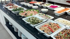 A buffet with various dishes including salads, vegetables, and grains. - INATEL Cerveira Hotel (Vila Nova de Cerveira)