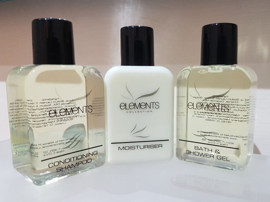 Three Elements Collection bottles: conditioning shampoo, moisturizer, and bath & shower gel.
