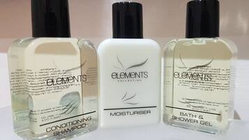 Three Elements Collection bottles: Conditioning Shampoo, Moisturiser, and Bath & Shower Gel.