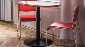 A room with a window, a radiator, a table, and two chairs. - Omena Hotel Tampere (Tampere)