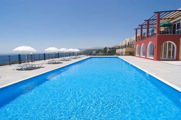 Outdoor pool, pool umbrellas, pool loungers