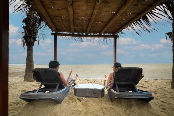 On the beach, sun loungers, beach massages, beach volleyball