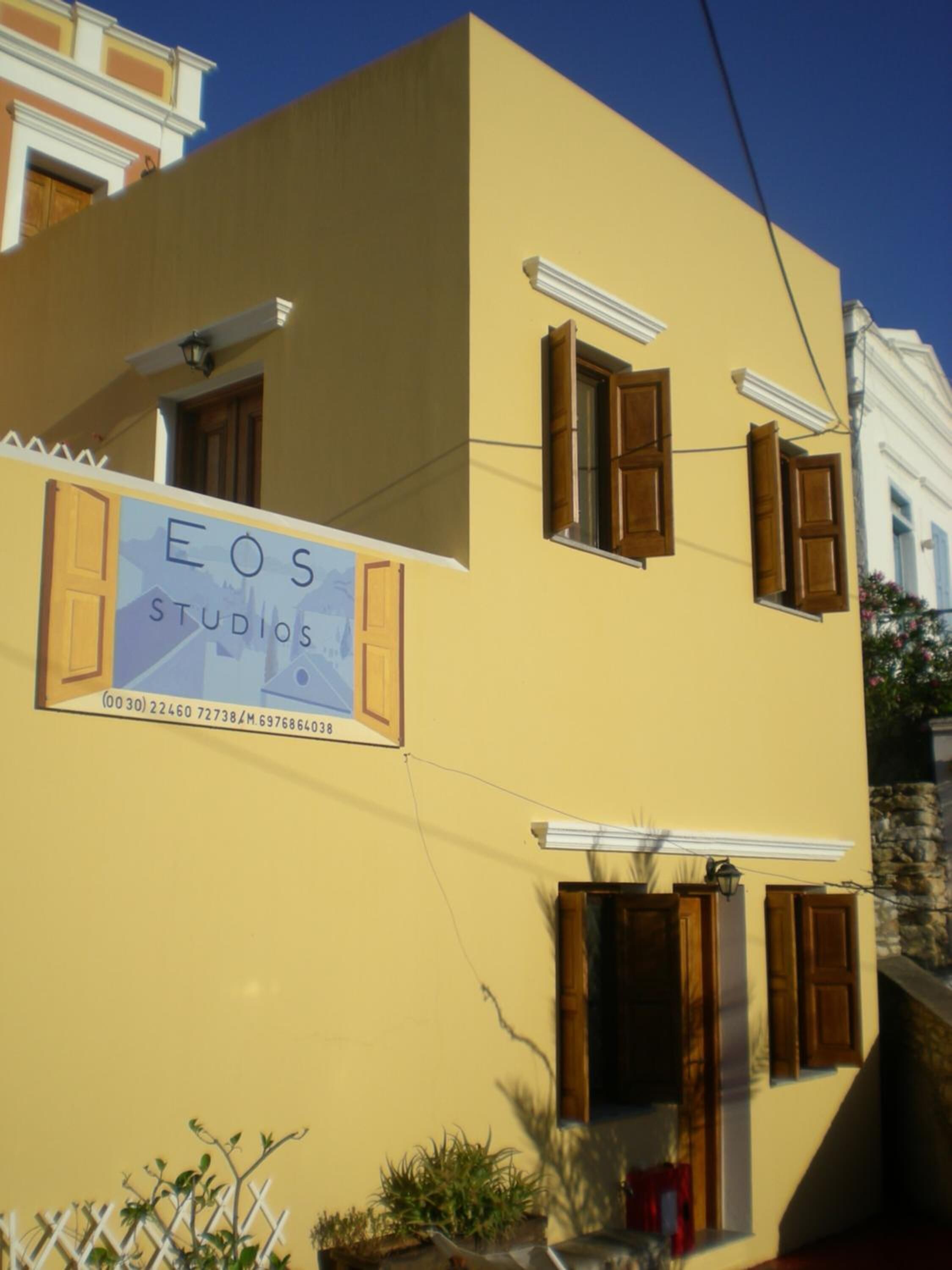A building with a sign that reads "EOS Studios".